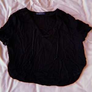 black crop top with lace-up neck